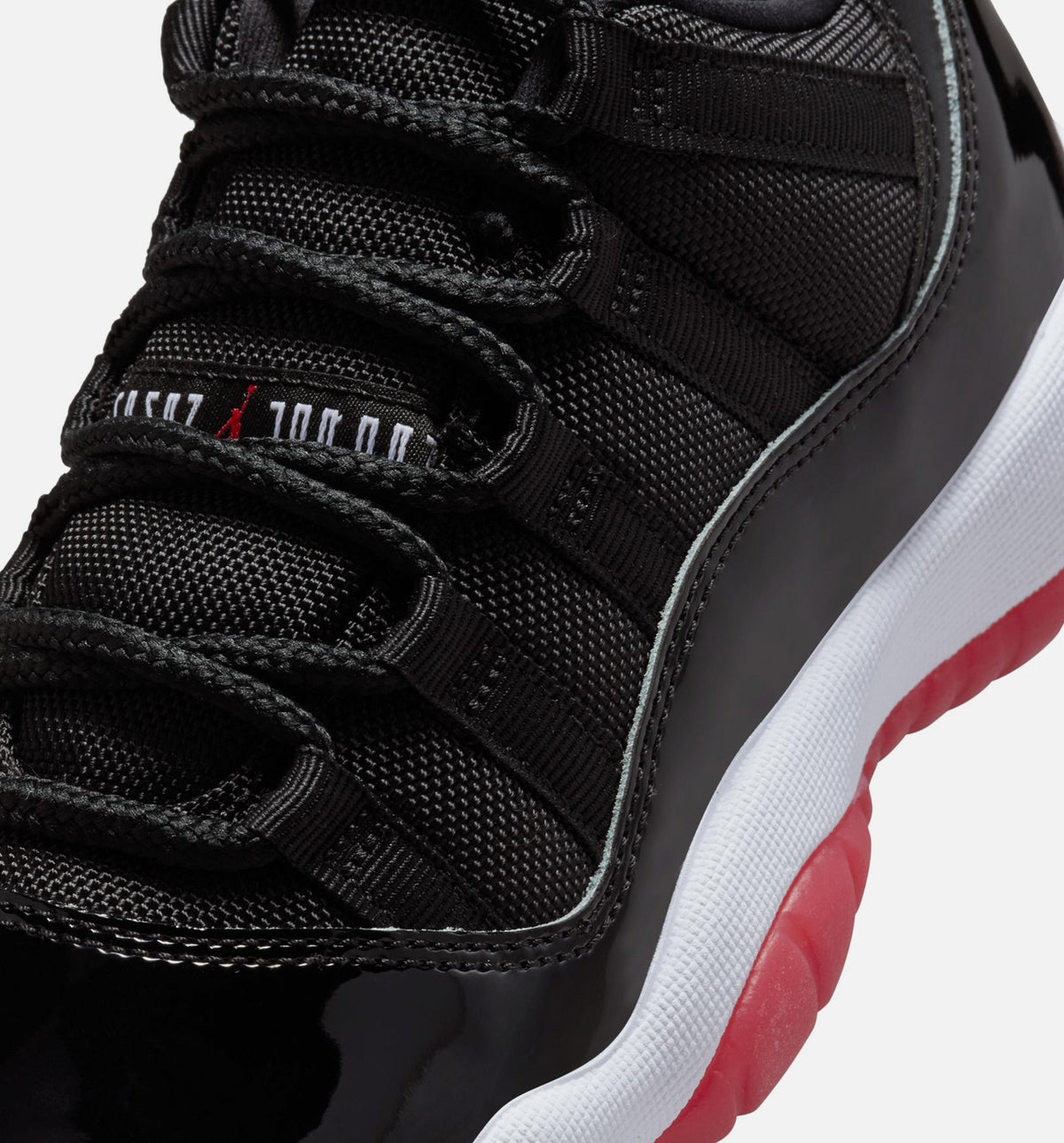 Air Jordan 11 Retro Bred – Grade School Lifestyle Shoe in Black/Varsity Red/White